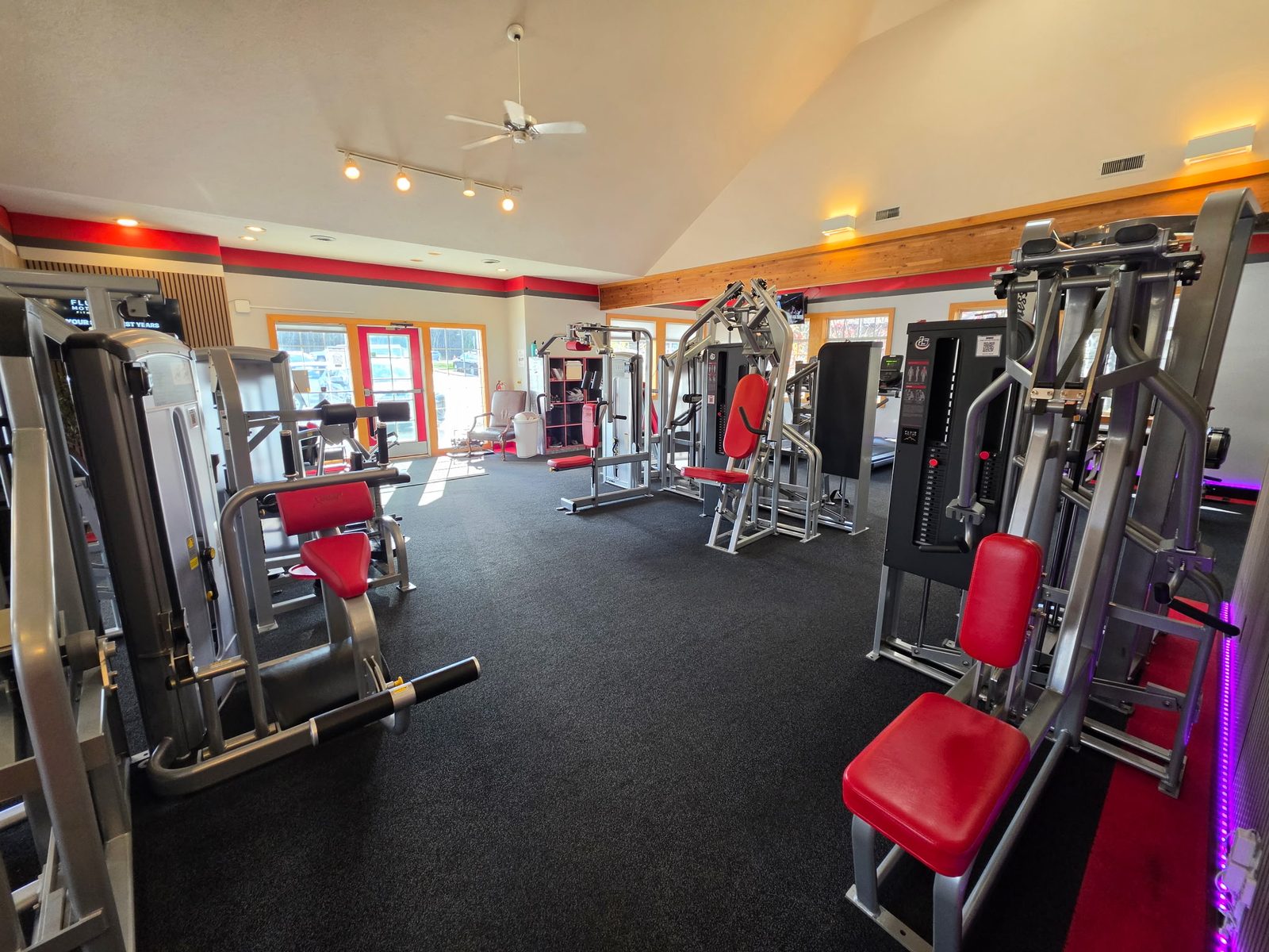 The gym floor and the red front entrance door