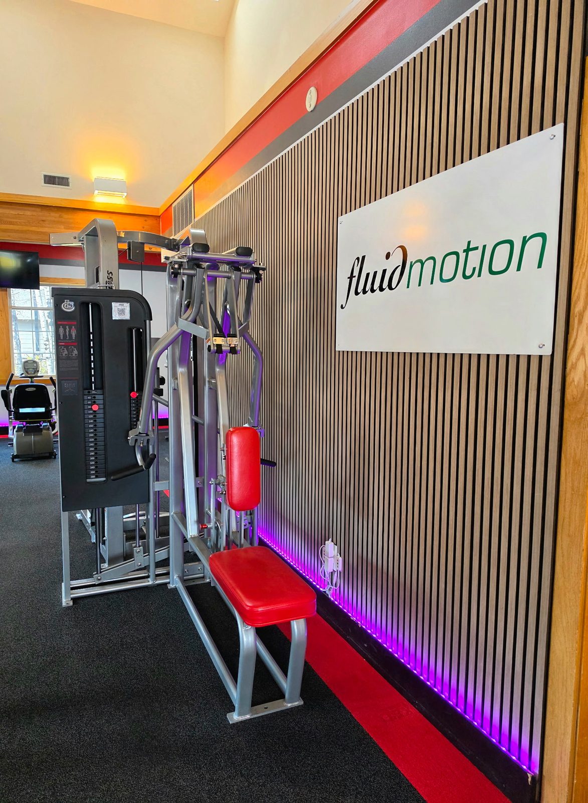 Strength machines beside the Fluid Motion sign